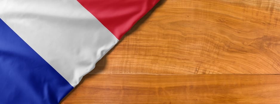 National flag of France on a wooden background with copy space
