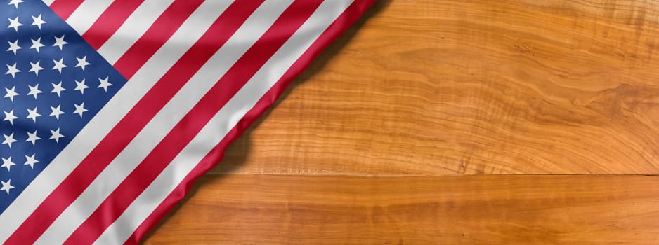 National flag of the United States of America on a wooden background