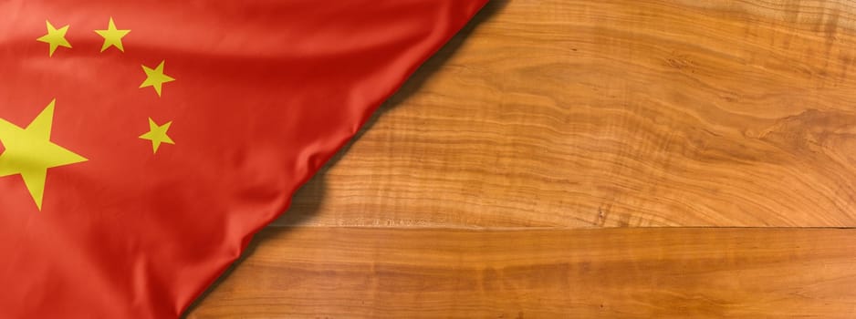 National flag of China on a wooden background with copy space