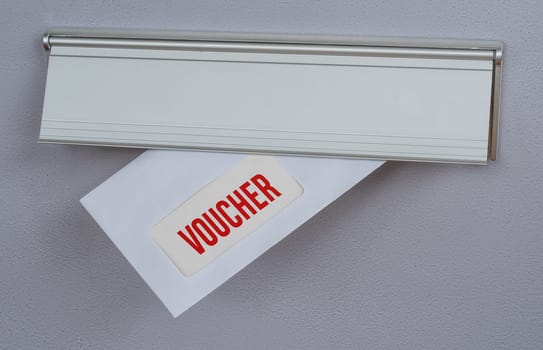 A letter in a mail slot - Voucher