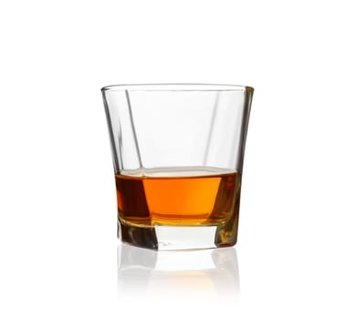 Glass of scotch whiskey isolated on a white background