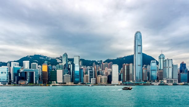 Stormy clouds over Hong Kong bay and island, wide panorama with city scyline, Victoria Peak, China