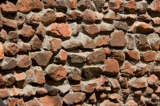 Construction of rubble stone masonry wall with dressed face bonded with cement concrete