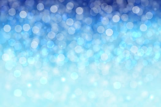 Abstract blurred festive winter christmas or Happy New Year background with shiny blue and white bokeh lighted snow landscape. Space for your design. Card concept.