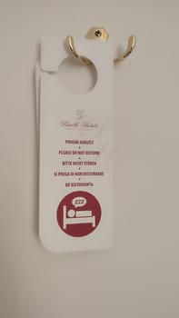 October 15 2024 Prague Czech Republic Europe Room service sign clean room simbol logo door handle bad white paper letter. High quality photo