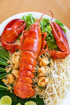 Lobster Pad thai, stir fried Thai rice noodle pasta with whole lobster and lobster meat.