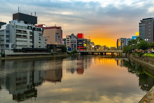 Fukuoka old town along naka river at Nakasukawabata sunset twilight. This area is favorite for tourist for Fukuoka Yatai, street Food stall,  for hangout at night.