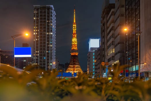 Tokyo Tower at dusk with Tokyo skyline city scape in monato ward. Tokyo Tower is famous landmark height 332.9 metres, the second-tallest tower in Japan.