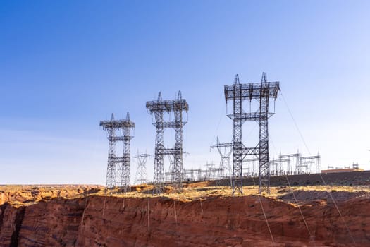 Power plant house and power line over Electricity generating dam in Page Arizona USA