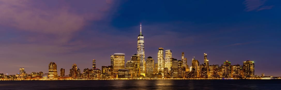 New York city Lower Manhattan skyline cityscape at dusk from New Jersey.