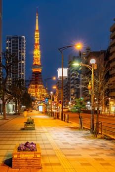 Tokyo Tower at dusk with Tokyo skyline city scape in monato ward. Tokyo Tower is famous landmark height 332.9 metres, the second-tallest tower in Japan.