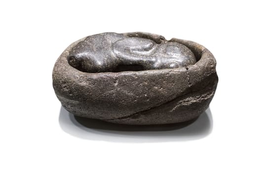 Madrid, Spain - Sept 8th, 2018: Stone sculpture depicting a fetus within an uterus, Inca Culture. Museum of the Americas, Madrid, Spain