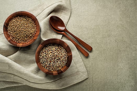 Dry quinoa seeds and buckwheat cereal grains. Superfood and healthy gluten free eating concept.