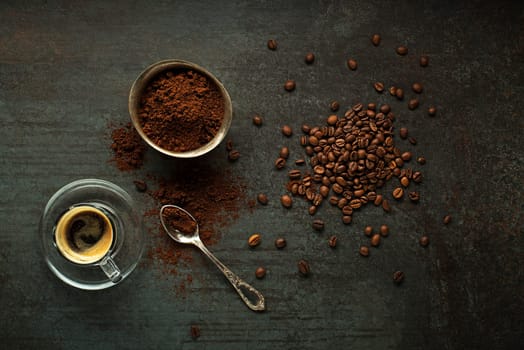 Espresso Coffee cup with beans on wooden table. Copyspace for your text