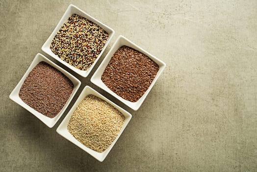 Various of healthy seeds - sesame, flax seed, chia seeds and psyllium. Copy space.