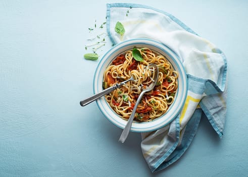 Tasty appetizing classic italian spaghetti pasta with tomato sauce, cheese parmesan and basil on plate. View from above, horizontal
