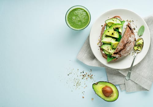 Delicious healthy meal served with Avocado sandwich made with fresh sliced avocados. Concept for a tasty and healthy meal.