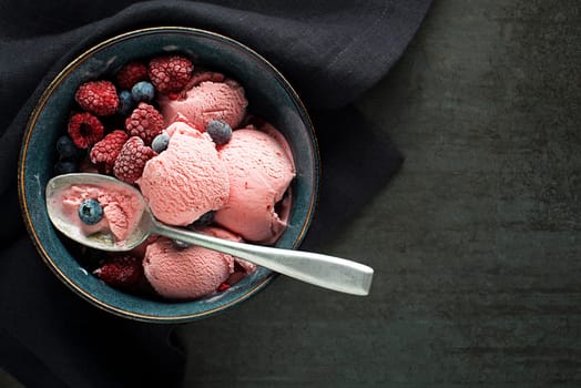 Fresh of soft icre cream or frozen yogurt with berry fruit flavours