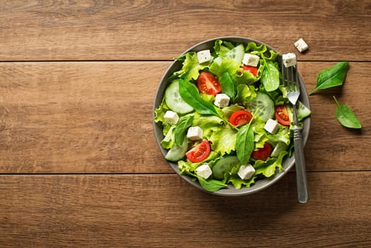 Healthy salad with spinach tomato and cheese. Home made food. Concept for a tasty and healthy meal.