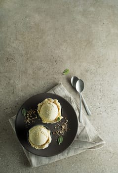 Homemade Organic Vanilla Ice Cream scoops in a plate close up