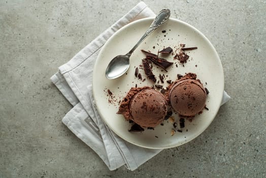 Homemade Organic chocolate Ice Cream scoops in a plate close up