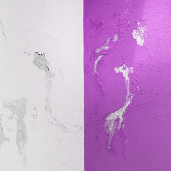 Peeling painted wall, texture, grunge background, cracked paint with violet wall.