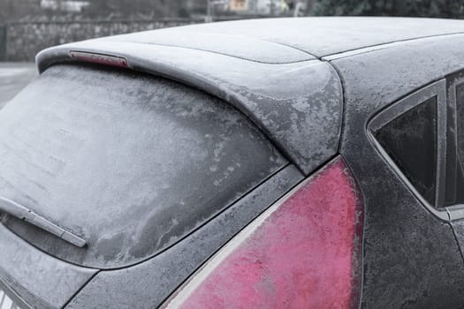 Frozen in the ice black car. Hoarfrost. Icy Accumulation. Ideal for concepts.
