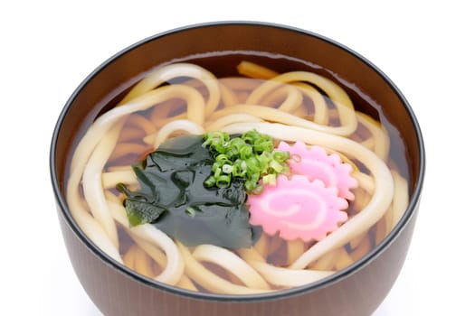 Japanese Kake udon noodles in a bowl on white background
