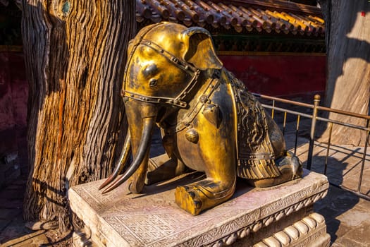 The bronze sitting elephant in the Forbidden City, popular tourist attraction, Beijing, China