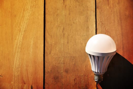 Led lamp on wooden floor
