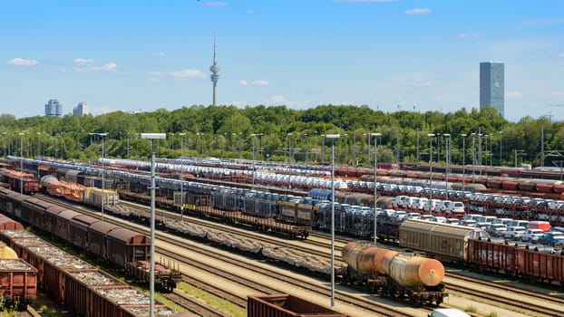 Munich, Germany - July 10, 2019: Panoramic view of Munich North rail classification yard with many many loaded wagons pending delivery