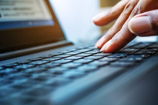 Networking and connecting concept, Hand human with keyboard on notebook computer blurred background