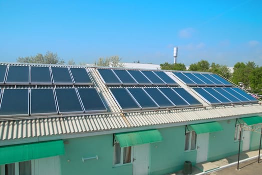 Solar water heating cells on the red roof. Gelio panels.