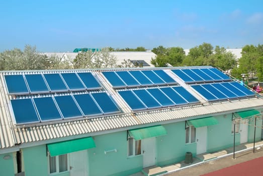 Solar water heating cells on the red roof. Gelio panels.