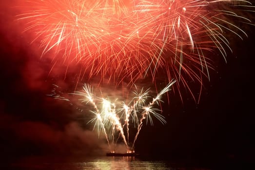 Colorful holiday fireworks on the black sky background.
