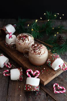 Hot chocolate topped with whipped cream and marshmallows