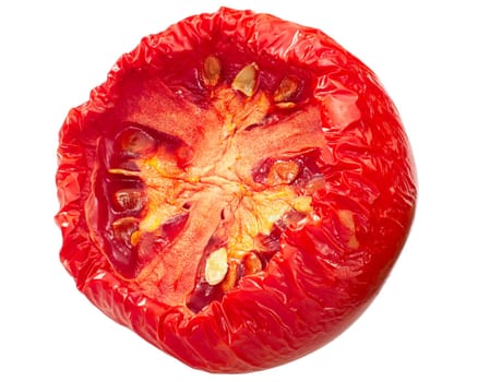 Semi-dried globe tomato half, isolated