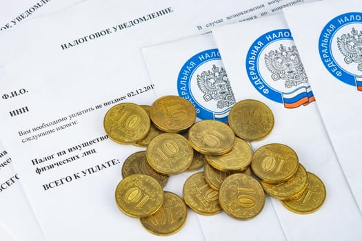 Anapa, Russia - September 3, 2019: Tax notice on which are coins of ten rubles