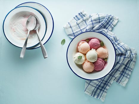 Set of soft ice cream scoops or frozen yoghurt of different colors and flavours with berries and fruits