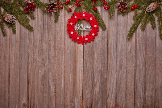 Wooden vintage background with fir tree branches and Christmas ornaments. Top view with copy space. New Year and Christmas, For greeting card or advertising