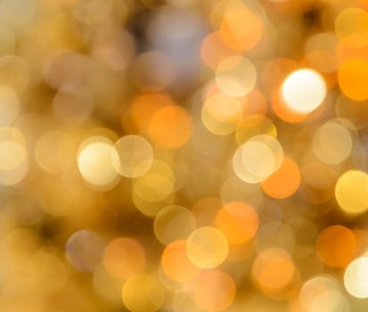 Defocused abstract yellow Christmas bokeh background