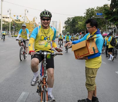 BANGKOK, THAILAND - DECEMBER 11, 2015 : "Bike for Dad"", Thai event to pay respect to King Bhumibol on his 88 th birthday celebration by participant cycling along the city road in Bangkok, Thailand"
