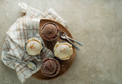 Set of ice cream scoops with chocolate and vanilla flavours