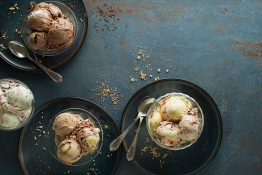 Variety of ice cream scoops with chocolate vanilla and fruity flavor