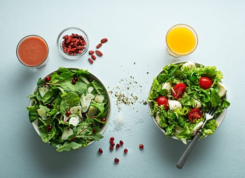 Healthy salads with spinach, cheese, tomato and seeds. Home made food. Concept for a tasty and healthy meal