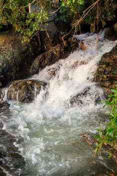 Streams of water from a rocky hill, mountain stream