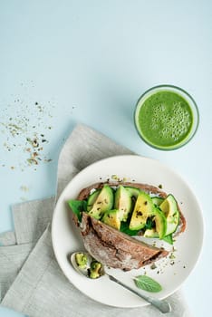 Delicious healthy meal with Avocado sandwich made with fresh sliced avocados. Concept for a tasty and healthy meal.