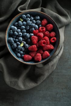 Berries overhead closeup colorful assorted mix of blueberry and raspberry