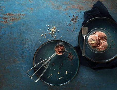 Chocolate ice cream scoop, scooped with a utensil