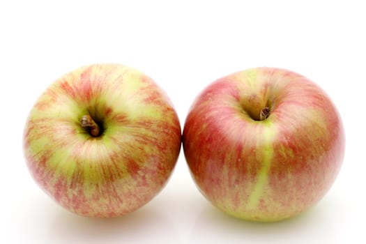 Red and green apple on a white background